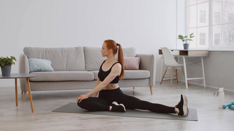 Person performing morning exercises in a bright living room